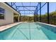 Refreshing screened-in pool area offering relaxation and privacy with its well-maintained pool and landscaping at 11993 Charades St, Orlando, FL 32832