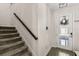 Staircase with carpet steps leading up to the second floor of the home at 11993 Charades St, Orlando, FL 32832