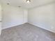 Neutral bedroom with plush carpeting, ample natural light, a simple ceiling fixture, and a generously sized closet at 131 Pecan Pass, Ocala, FL 34472