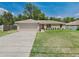 Charming single-story home with a well-maintained lawn and a two-car garage at 131 Pecan Pass, Ocala, FL 34472