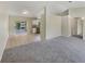 Open-concept living area with a seamless transition to the kitchen and screened patio at 131 Pecan Pass, Ocala, FL 34472