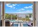 Balcony view showcasing a beautiful waterfront view with a pool at 13415 Blue Heron Beach Dr # 409, Orlando, FL 32821