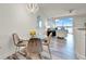 Dining area with sliding glass doors with furniture and a view of the ocean at 13415 Blue Heron Beach Dr # 409, Orlando, FL 32821