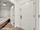 Apartment entry featuring white doors and hallway leading to a bedroom at 13415 Blue Heron Beach Dr # 409, Orlando, FL 32821
