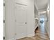 Hallway featuring a bunk room with wood flooring and views of the living area at 13415 Blue Heron Beach Dr # 409, Orlando, FL 32821