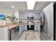 Well-equipped kitchen featuring granite countertops and modern stainless steel appliances at 13415 Blue Heron Beach Dr # 409, Orlando, FL 32821