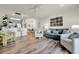 Comfortable living room featuring stylish decor, wood floors, and an open layout at 13415 Blue Heron Beach Dr # 409, Orlando, FL 32821