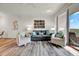 Inviting living room with modern decor, light wood floors, and access to the balcony at 13415 Blue Heron Beach Dr # 409, Orlando, FL 32821