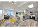 Bright and airy living space with a modern kitchen, stainless steel appliances, and water view from the balcony at 13415 Blue Heron Beach Dr # 409, Orlando, FL 32821