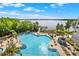 Enjoy access to this large in-ground community pool with views of the lake and walking pier at 13415 Blue Heron Beach Dr # 409, Orlando, FL 32821