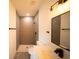 Contemporary bathroom boasts a tiled shower, quartz countertop, and sleek finishes at 13621 Sw 40Th Cir, Ocala, FL 34473