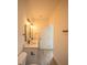 Bathroom features double sinks, quartz countertops, and modern vanity lighting at 13621 Sw 40Th Cir, Ocala, FL 34473