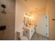 Bathroom featuring double vanity, walk-in shower with elegant dark fixtures and accents at 13621 Sw 40Th Cir, Ocala, FL 34473
