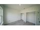 Bedroom featuring closets with double doors, creating plenty of storage space at 13621 Sw 40Th Cir, Ocala, FL 34473