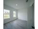 Cozy bedroom features a bright open window view and ample space at 13621 Sw 40Th Cir, Ocala, FL 34473