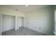 Bedroom featuring closets with double doors, creating plenty of storage space at 13621 Sw 40Th Cir, Ocala, FL 34473