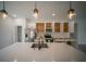 Modern kitchen featuring stainless steel appliances, a center island, and stylish pendant lighting at 13621 Sw 40Th Cir, Ocala, FL 34473
