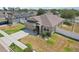 Aerial view of home featuring a well-maintained front yard and a spacious driveway at 140 Highland Meadows St, Davenport, FL 33837