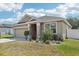 Single-story home boasting a well-kept lawn, paved driveway, and a convenient two-car garage at 140 Highland Meadows St, Davenport, FL 33837