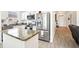 Kitchen featuring stainless steel appliances, granite countertops, and ample cabinet space at 140 Highland Meadows St, Davenport, FL 33837