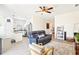 Open living room showcasing neutral walls, modern furnishings, and seamless flow to the adjacent kitchen area at 140 Highland Meadows St, Davenport, FL 33837