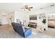 Cozy living room featuring neutral walls, ceiling fan, and contemporary furnishings, including a reclining sofa at 140 Highland Meadows St, Davenport, FL 33837