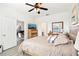 The beautiful main bedroom has modern décor and is situated next to the common area of the house at 140 Highland Meadows St, Davenport, FL 33837