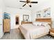 Spacious main bedroom with walk-in closet, soft colors, and ceiling fan at 140 Highland Meadows St, Davenport, FL 33837