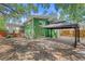 Exterior shot showcasing the backyard with a gazebo, mature trees, and well-maintained lawn at 141 S Lawsona Blvd, Orlando, FL 32801