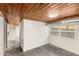 Basement with unfinished floor and wood ceiling, with updated windows letting in plenty of natural light at 141 S Lawsona Blvd, Orlando, FL 32801