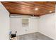 Basement featuring a wood ceiling, pot lights, updated windows, and an unfinished floor at 141 S Lawsona Blvd, Orlando, FL 32801