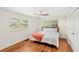 Bedroom featuring hardwood floors and a ceiling fan at 141 S Lawsona Blvd, Orlando, FL 32801