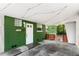 A covered carport leads to the side door, featuring exposed beams and string lights at 141 S Lawsona Blvd, Orlando, FL 32801