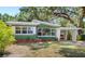 Single-story home featuring a carport and well-maintained landscaping at 141 S Lawsona Blvd, Orlando, FL 32801