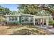 Charming single-story home featuring a carport and well-maintained landscaping at 141 S Lawsona Blvd, Orlando, FL 32801