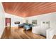 Bright living room features a fireplace, wood floors, and a sectional couch at 141 S Lawsona Blvd, Orlando, FL 32801