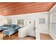 Cozy living room with hardwood floors, a comfortable couch, and a painted ceiling at 141 S Lawsona Blvd, Orlando, FL 32801