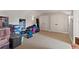 Spacious attic with carpet floors and storage, offering versatility and potential for customization at 141 S Phelps Ave, Winter Park, FL 32789