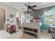 Cheerful bedroom with unique wall colors, desk, storage, and easy access to bathroom at 141 S Phelps Ave, Winter Park, FL 32789
