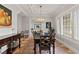 Dining room features coffered ceilings, an area rug, and an adjacent sitting area at 141 S Phelps Ave, Winter Park, FL 32789