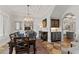 Formal dining room with coffered ceilings, wooden table, area rug, and adjacent bar area at 141 S Phelps Ave, Winter Park, FL 32789