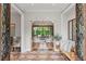 Welcoming home foyer with decorative tile flooring and an open view to the living area at 141 S Phelps Ave, Winter Park, FL 32789