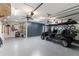Well-organized garage with custom cabinets and ample storage space for vehicles and equipment at 141 S Phelps Ave, Winter Park, FL 32789