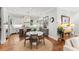 Beautiful kitchen featuring white cabinets, granite countertops, and a cozy dining area at 141 S Phelps Ave, Winter Park, FL 32789