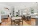 Bright, modern kitchen with an island, stainless steel appliances, and dining area at 141 S Phelps Ave, Winter Park, FL 32789