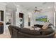 Relaxing living room with a large TV, comfortable seating, and built-in storage at 141 S Phelps Ave, Winter Park, FL 32789