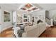Living room features coffered ceilings, hardwood floors, fireplace, and lots of natural light at 141 S Phelps Ave, Winter Park, FL 32789