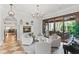 Spacious living room with fireplace, comfortable seating, and access to the outdoor patio at 141 S Phelps Ave, Winter Park, FL 32789
