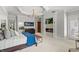Bright main bedroom with a fireplace, TV, and access to the outdoors at 141 S Phelps Ave, Winter Park, FL 32789