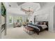 Luxurious main bedroom boasts a decorative ceiling, large windows, and a comfortable seating area at 141 S Phelps Ave, Winter Park, FL 32789
